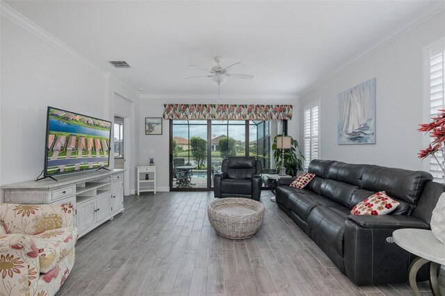3051 Francoa Dr, Odessa, FL 33556 - living area featuring ceiling fan, light wood-style flooring, ornamental molding, and baseboards