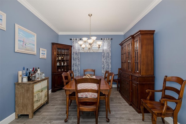 3051 Francoa Dr, Odessa, FL 33556 - dining room featuring a chandelier, wood tiled floors, crown molding, and baseboards