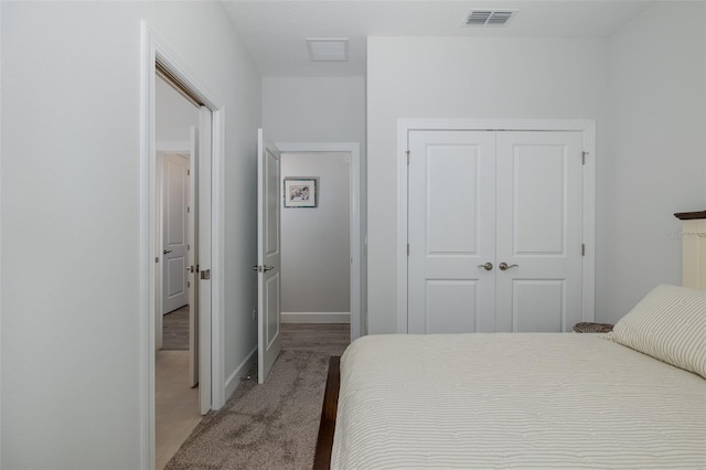 3051 Francoa Dr, Odessa, FL 33556 - bedroom featuring a closet, light carpet, and baseboards