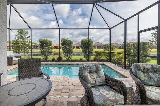 3051 Francoa Dr, Odessa, FL 33556 - outdoor pool with glass enclosure, a patio area, and a water view