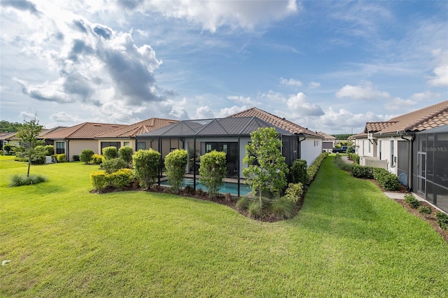 3051 Francoa Dr, Odessa, FL 33556 - back of property featuring a lawn, a residential view, a lanai, and stucco siding