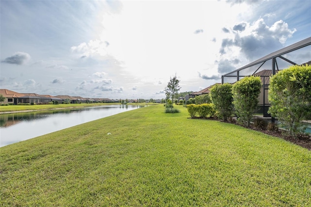 3051 Francoa Dr, Odessa, FL 33556 - view of green lawn with a water view, glass enclosure, and a residential view