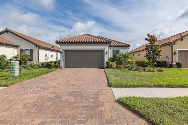 3051 Francoa Dr, Odessa, FL 33556 - mediterranean / spanish-style house with a tile roof, decorative driveway, stucco siding, and a front yard