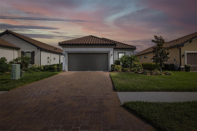 3051 Francoa Dr, Odessa, FL 33556 - mediterranean / spanish house with decorative driveway, a tile roof, an attached garage, and stucco siding