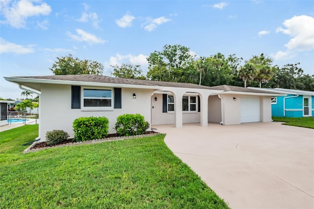 4468 Rudder Way, New Port Richey, FL 34652 - ranch-style home featuring an attached garage, concrete driveway, stucco siding, and a front lawn