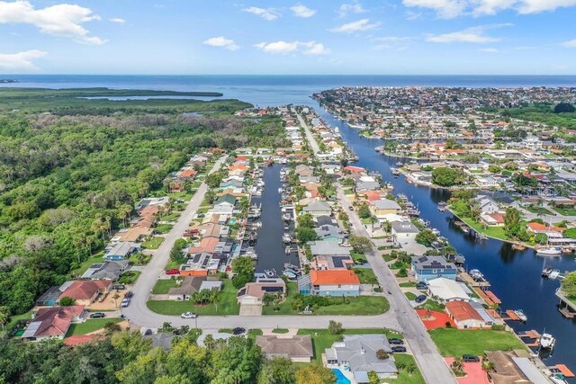 4468 Rudder Way, New Port Richey, FL 34652 - aerial view of property and surrounding area with a large body of water and nearby suburban area
