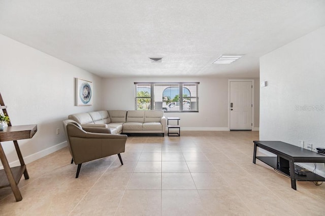 4468 Rudder Way, New Port Richey, FL 34652 - living room with light tile patterned flooring, baseboards, and a textured ceiling