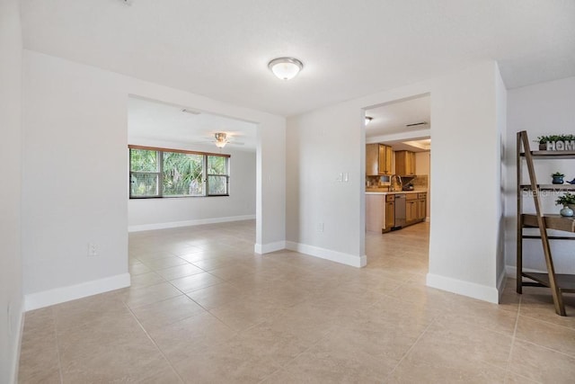 4468 Rudder Way, New Port Richey, FL 34652 - spare room featuring light tile patterned floors and baseboards