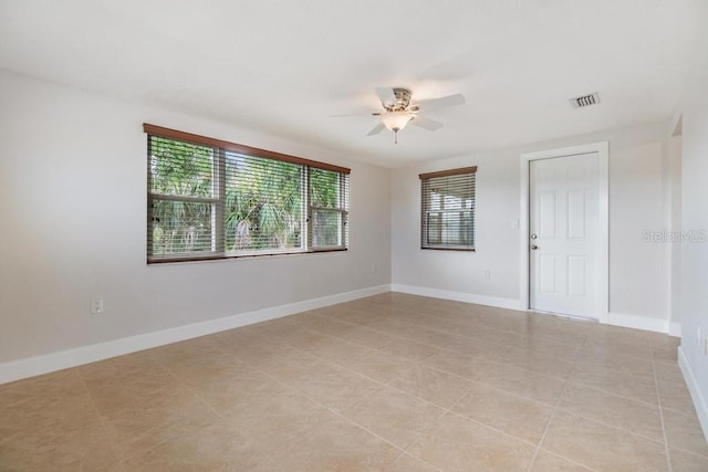 4468 Rudder Way, New Port Richey, FL 34652 - unfurnished room featuring ceiling fan, light tile patterned flooring, and baseboards