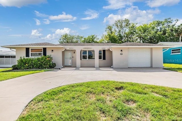 4468 Rudder Way, New Port Richey, FL 34652 - ranch-style house featuring stucco siding, driveway, a garage, and a front lawn