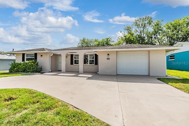 4468 Rudder Way, New Port Richey, FL 34652 - single story home featuring driveway, an attached garage, stucco siding, and a front yard