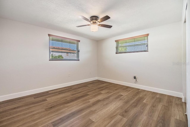4468 Rudder Way, New Port Richey, FL 34652 - empty room featuring baseboards, wood finished floors, ceiling fan, and a textured ceiling
