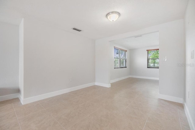 4468 Rudder Way, New Port Richey, FL 34652 - empty room with light tile patterned flooring and baseboards