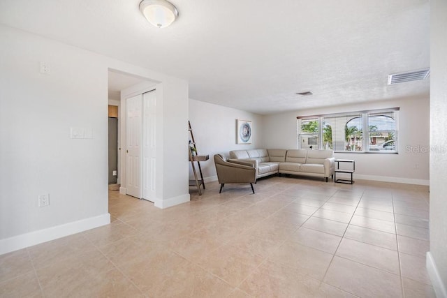 4468 Rudder Way, New Port Richey, FL 34652 - living area featuring light tile patterned flooring and baseboards