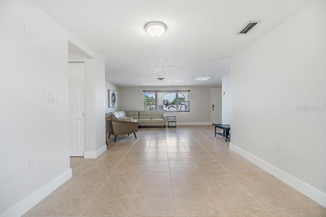 4468 Rudder Way, New Port Richey, FL 34652 - living room featuring light tile patterned flooring and baseboards
