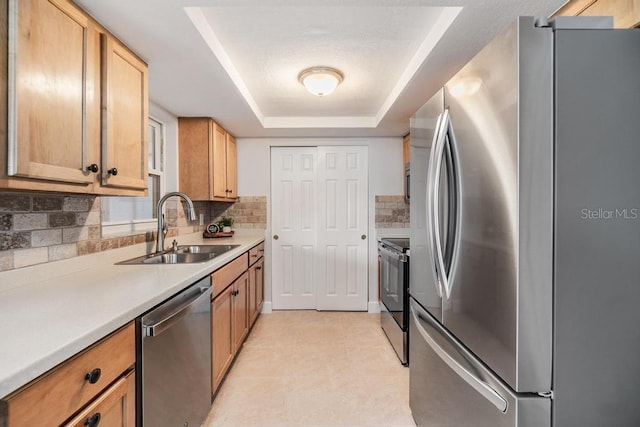 4468 Rudder Way, New Port Richey, FL 34652 - kitchen with stainless steel appliances, a sink, a raised ceiling, and decorative backsplash