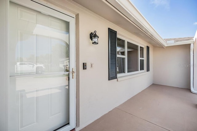 4468 Rudder Way, New Port Richey, FL 34652 - doorway to property featuring stucco siding