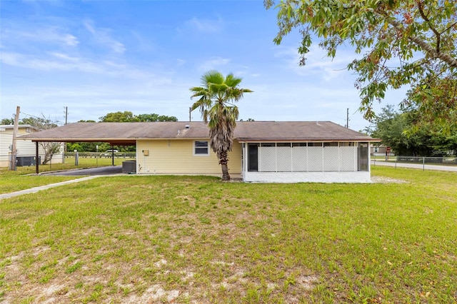 12936 Parkwood St, Hudson, FL 34669 - rear view of property featuring an attached carport and cooling unit