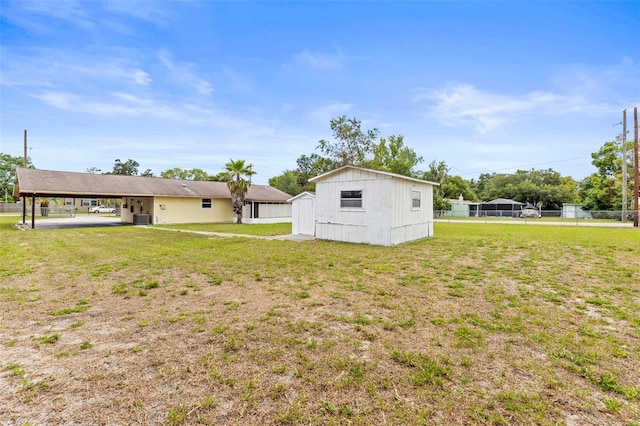 12936 Parkwood St, Hudson, FL 34669 - view of yard with central AC unit and an attached carport