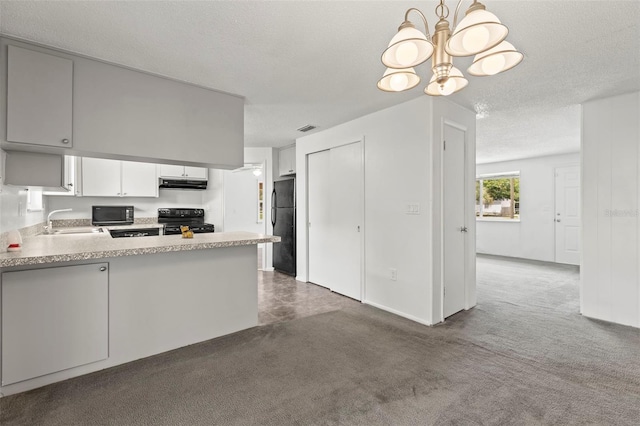 12936 Parkwood St, Hudson, FL 34669 - kitchen featuring black appliances, a sink, under cabinet range hood, a chandelier, and dark colored carpet