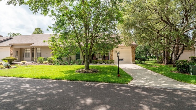 6620 Brambleleaf Dr, Spring Hill, FL 34606 - view of front of home with driveway, a front yard, and a garage