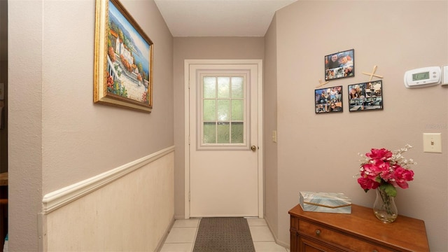 6620 Brambleleaf Dr, Spring Hill, FL 34606 - doorway to outside featuring light tile patterned flooring