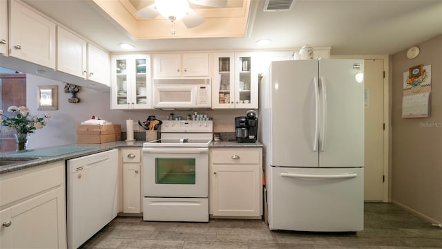 6620 Brambleleaf Dr, Spring Hill, FL 34606 - kitchen with white appliances, white cabinetry, light wood finished floors, a ceiling fan, and glass insert cabinets