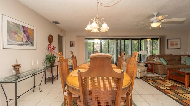 6620 Brambleleaf Dr, Spring Hill, FL 34606 - dining space featuring light tile patterned floors, a chandelier, a ceiling fan, and a textured ceiling