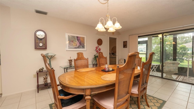 6620 Brambleleaf Dr, Spring Hill, FL 34606 - dining space featuring a chandelier, light tile patterned floors, and baseboards