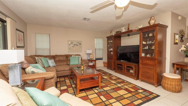 6620 Brambleleaf Dr, Spring Hill, FL 34606 - living area with ceiling fan, light tile patterned floors, and a textured ceiling
