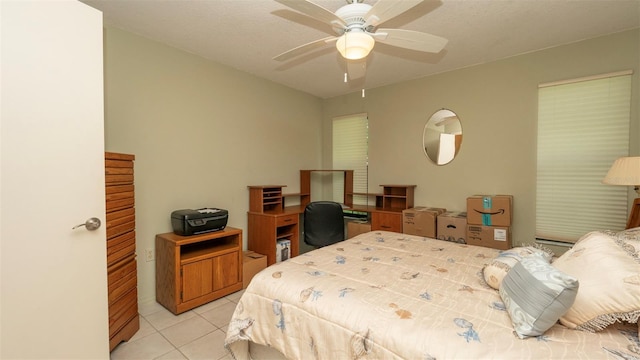 6620 Brambleleaf Dr, Spring Hill, FL 34606 - bedroom featuring light tile patterned floors and a ceiling fan