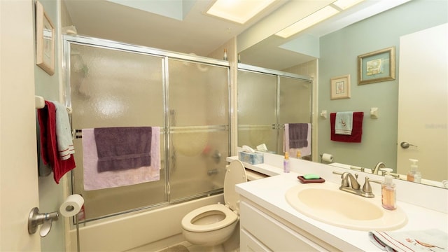 6620 Brambleleaf Dr, Spring Hill, FL 34606 - bathroom featuring vanity, toilet, and combined bath / shower with glass door