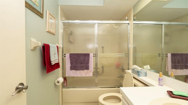 6620 Brambleleaf Dr, Spring Hill, FL 34606 - bathroom with vanity, toilet, and shower / bath combination with glass door