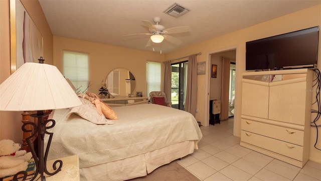 6620 Brambleleaf Dr, Spring Hill, FL 34606 - bedroom featuring light tile patterned flooring and ceiling fan