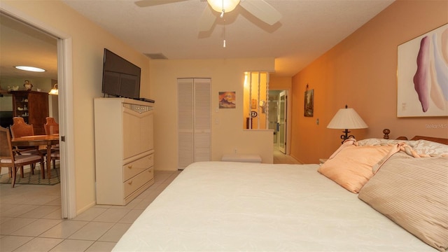6620 Brambleleaf Dr, Spring Hill, FL 34606 - bedroom with light tile patterned floors, a closet, and a ceiling fan
