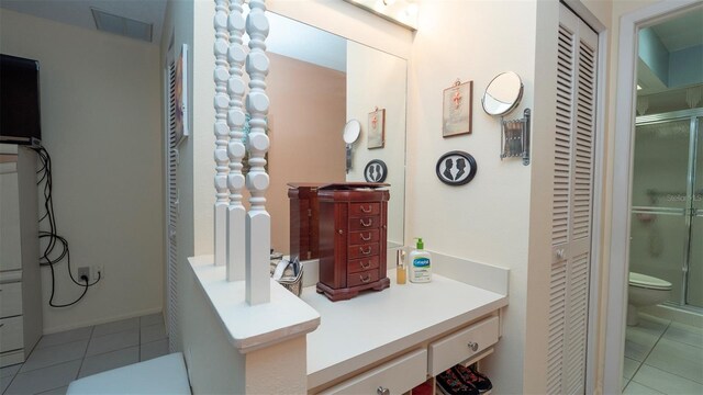 6620 Brambleleaf Dr, Spring Hill, FL 34606 - full bathroom with a closet, tile patterned floors, toilet, a shower stall, and vanity
