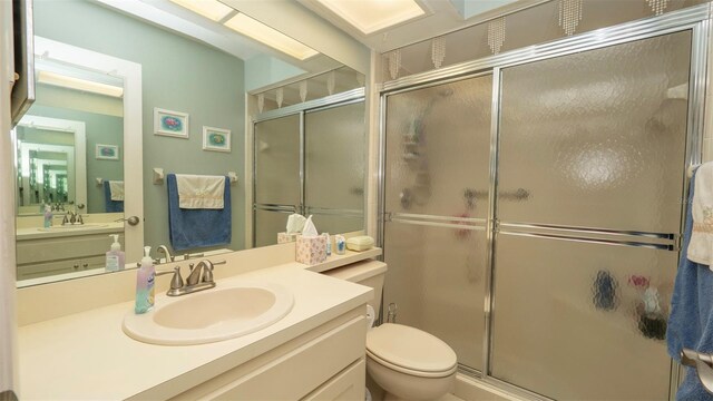 6620 Brambleleaf Dr, Spring Hill, FL 34606 - bathroom with a stall shower, vanity, and toilet