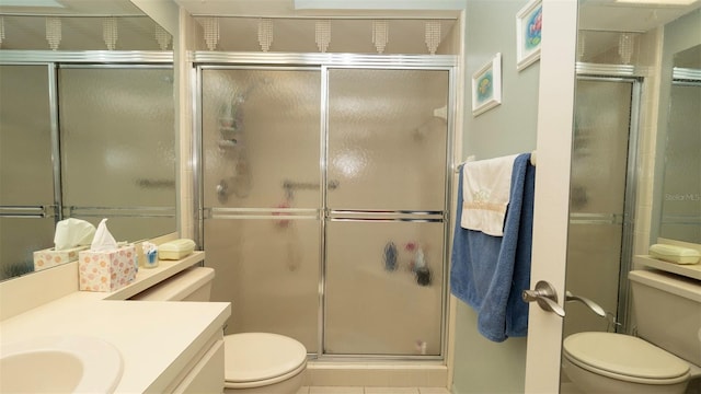 6620 Brambleleaf Dr, Spring Hill, FL 34606 - full bathroom featuring toilet, vanity, an enclosed shower, and tile patterned flooring