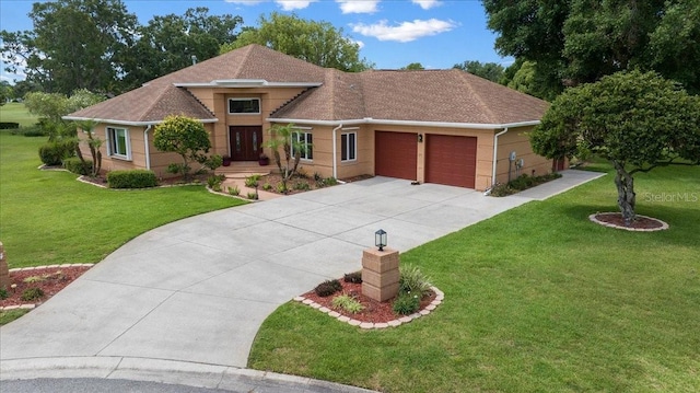 10044 Twelve Oaks Ct, Weeki Wachee, FL 34613 - view of front facade with a garage, a front yard, concrete driveway, roof with shingles, and brick siding