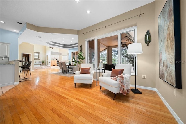 10044 Twelve Oaks Ct, Weeki Wachee, FL 34613 - living area with light wood finished floors, baseboards, and recessed lighting