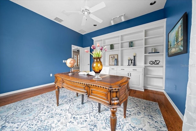 10044 Twelve Oaks Ct, Weeki Wachee, FL 34613 - office space with dark wood-style flooring, a ceiling fan, and baseboards