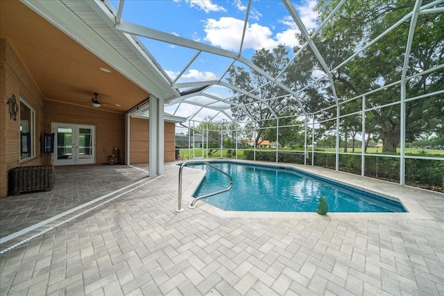 10044 Twelve Oaks Ct, Weeki Wachee, FL 34613 - outdoor pool with french doors, a patio area, a ceiling fan, and glass enclosure