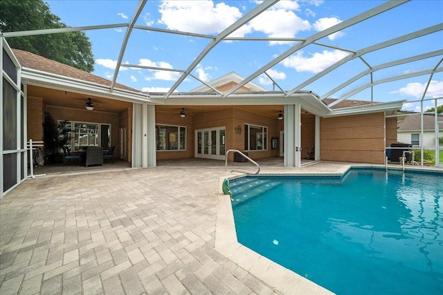10044 Twelve Oaks Ct, Weeki Wachee, FL 34613 - swimming pool featuring a ceiling fan, french doors, a patio area, grilling area, and glass enclosure