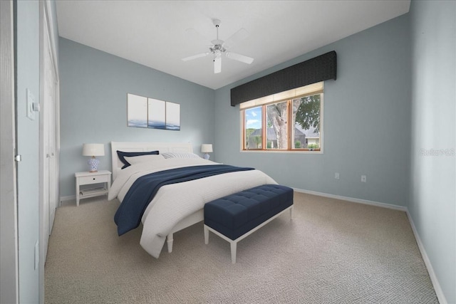 10044 Twelve Oaks Ct, Weeki Wachee, FL 34613 - bedroom with carpet flooring, baseboards, and a ceiling fan