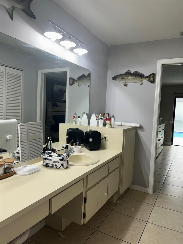 13316 Brigham Ln, Hudson, FL 34667 - bathroom featuring a closet, tile patterned floors, and vanity