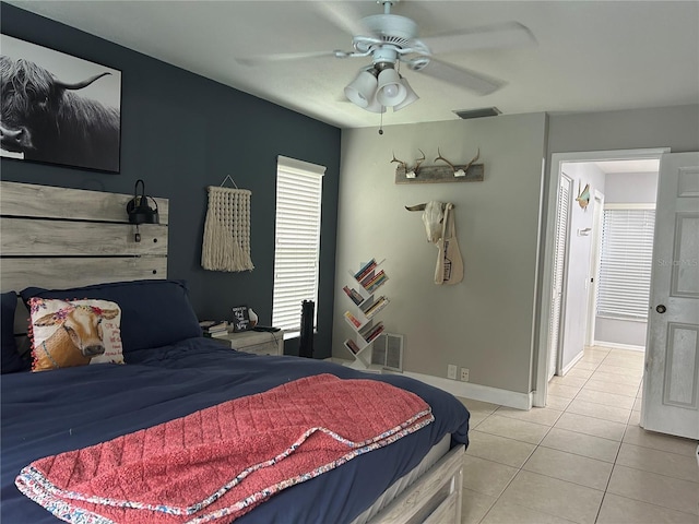 13316 Brigham Ln, Hudson, FL 34667 - bedroom with tile patterned flooring, ceiling fan, and baseboards