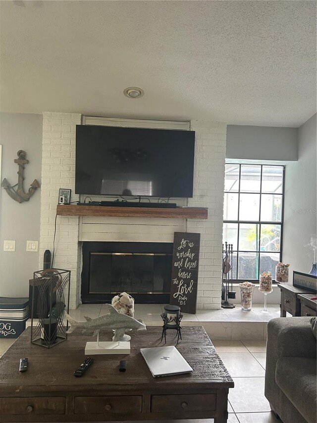 13316 Brigham Ln, Hudson, FL 34667 - living area featuring a fireplace, a textured ceiling, and tile patterned floors