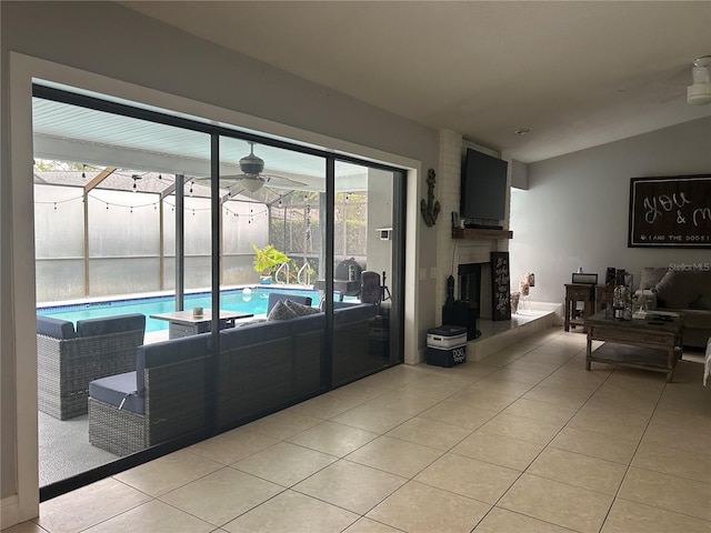 13316 Brigham Ln, Hudson, FL 34667 - living area with light tile patterned flooring, healthy amount of natural light, and ceiling fan