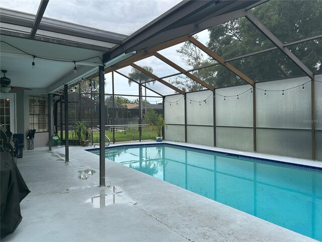 13316 Brigham Ln, Hudson, FL 34667 - outdoor pool with a patio, a lanai, and a ceiling fan
