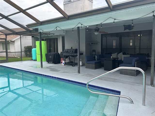 13316 Brigham Ln, Hudson, FL 34667 - outdoor pool featuring a patio area, an outdoor hangout area, a ceiling fan, and a lanai